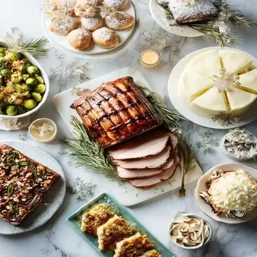 festive holiday meal with glazed roast pork, cake, Brussels sprouts, desserts, and winter-themed garnishes on marble surface